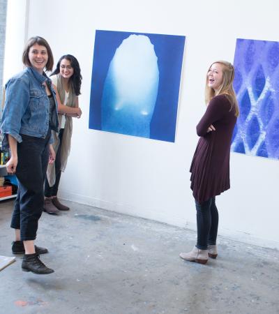 people in front of wall work during open studio tour