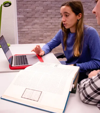 students looking at laptop together