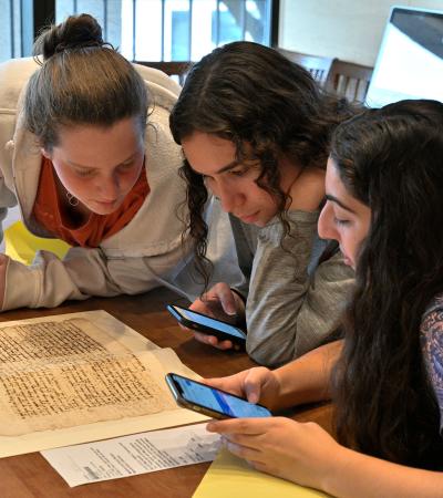 students looking at historical document