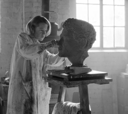 film still of woman sculpting clay