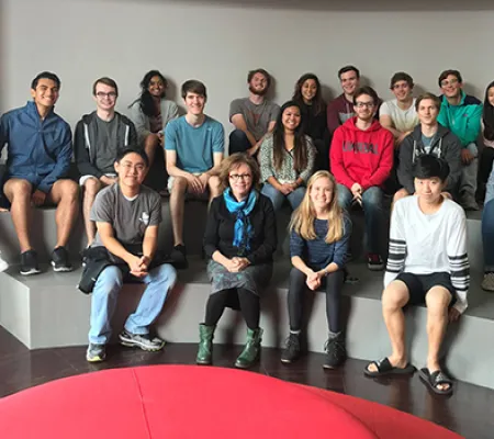 image of a class with professor posing for portrait