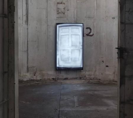 image of a door duplicated via video and washed out of saturation inside of a repurposed grain silo in houston
