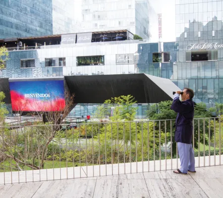 artist michael smith scanning horizon with binoculars 