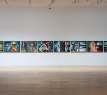 installation image of photographs on the wall
