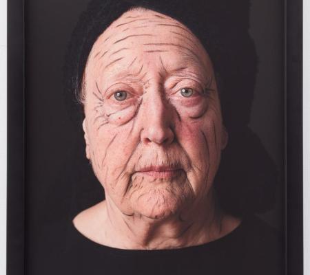 Portrait of older, woman with purposefully over-defined wrinkles