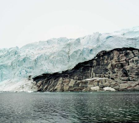 photograph of land mass in Arctic ocean