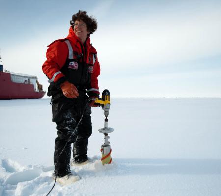 Chris Linder: Heloise Chenelot, a technician from the University of Alaska Fairbanks, takes ice cores with a corer that runs off an electric drill, 2009.