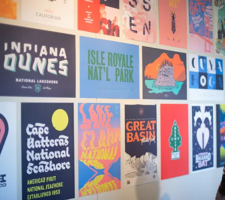 person looking at posters in gallery