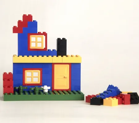 photo of legos stacked to resemble house or structure for Sean Carney lecture on empowerment and artist run organizations for undergraduates art career CORE 