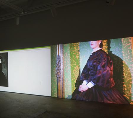 video installation still of woman dressed as historical figure