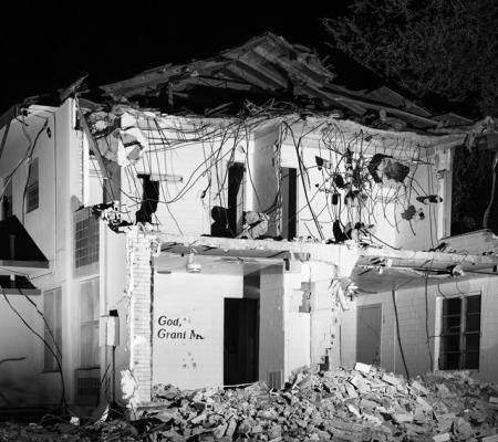 black and white image of a destroyed house