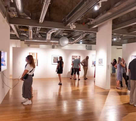 image of people looking at work in a gallery