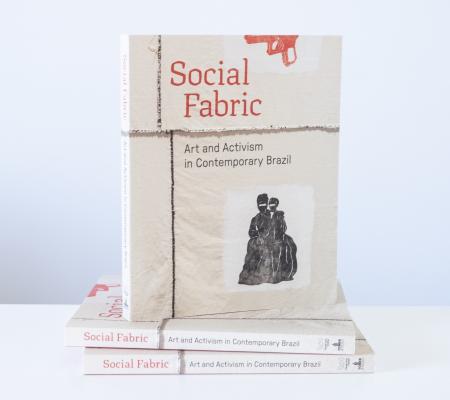 image of 3 social fabric books posed in front of a white wall