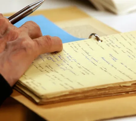 image of hand on a notepad
