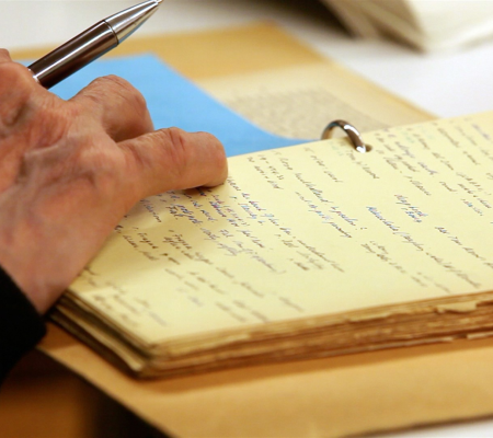 image of hand on a notepad