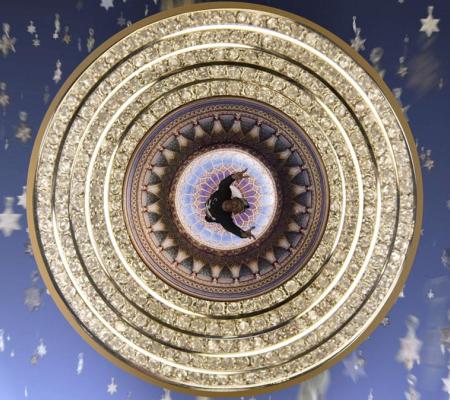 composite image: human figure seen from above in concentric gold circles against blue background