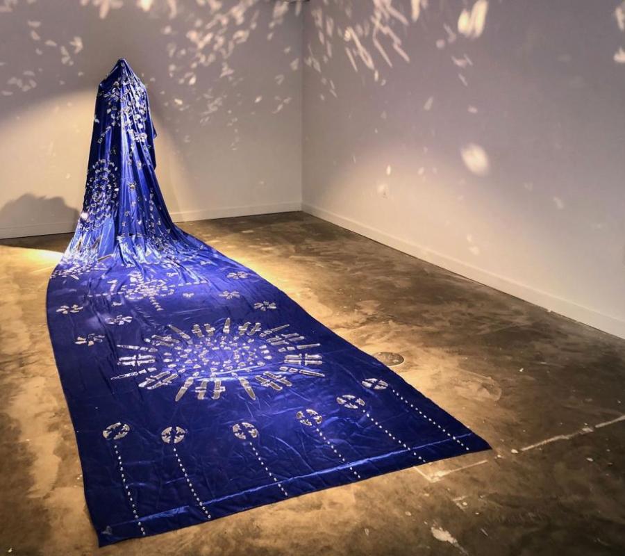 image of blue cloth draped across floor