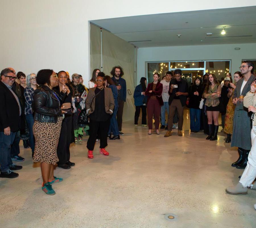 people in gallery during artist-led tour of exhibition