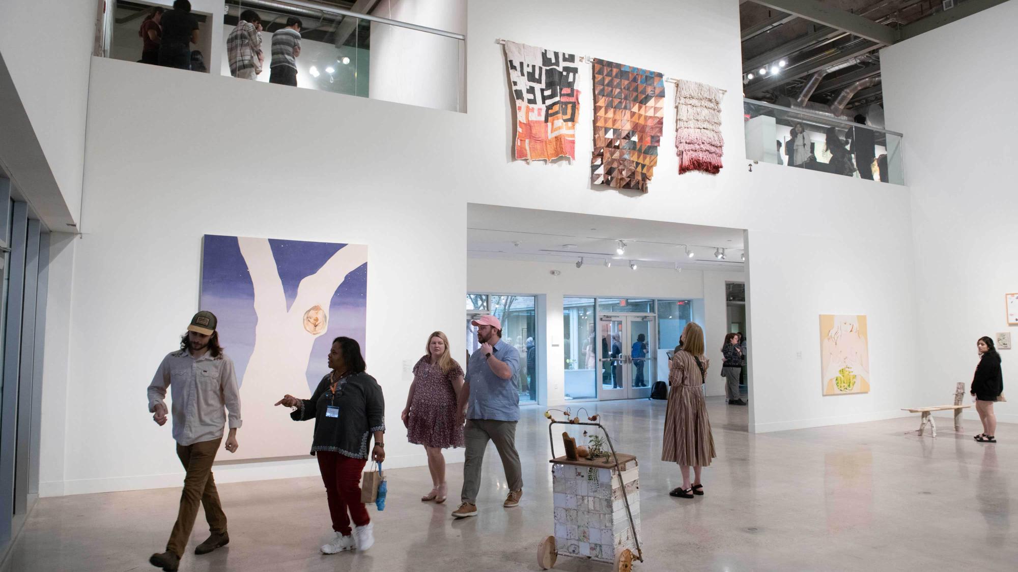 people in gallery during art opening