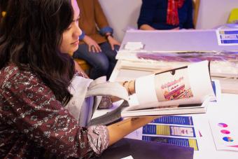 student looking at research materials