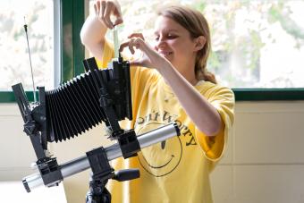 student using a large-format camera