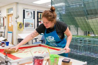 student working with a serigraphy screen