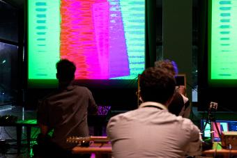 students in front of projection screen