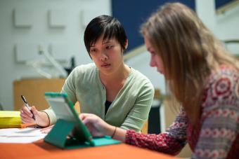 two people looking at tablet together