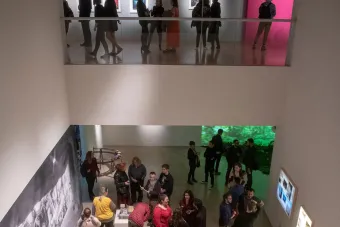 people in gallery during art opening