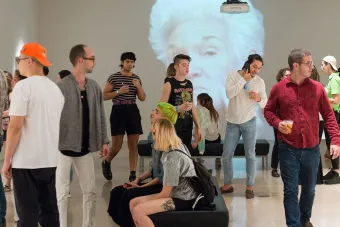 people in gallery during art opening