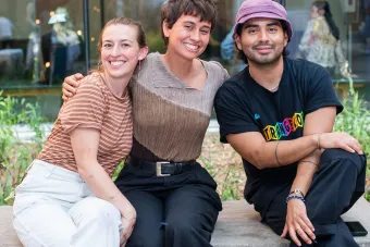 three people posing for photo