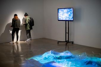 people in gallery viewing artwork