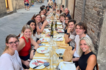 group of students sitting at long table