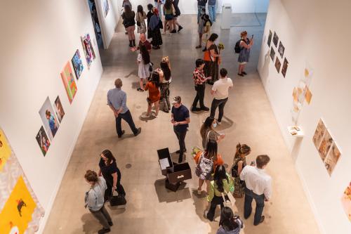 people in gallery during art opening