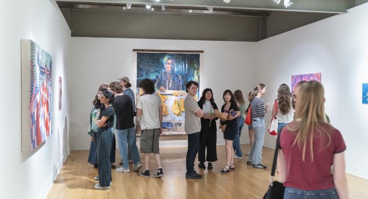 people in gallery during art opening