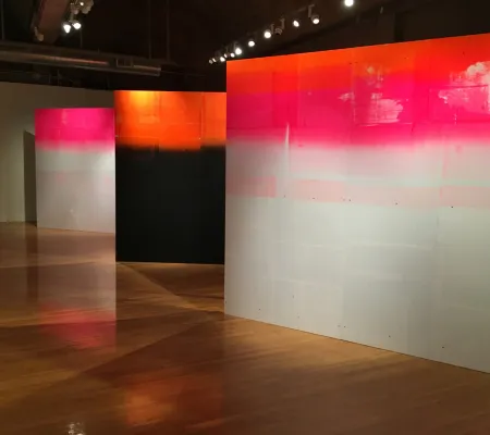 exhibition view of three large scale print walls