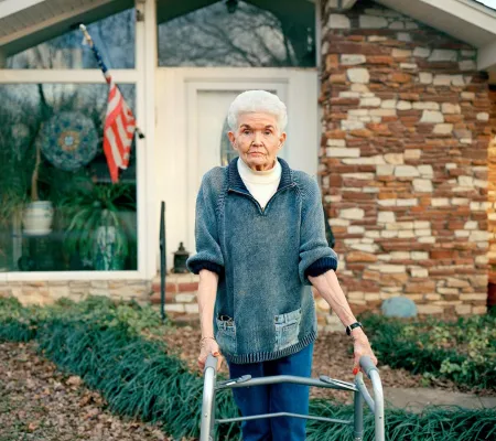 image of an elderly woman with a walker 