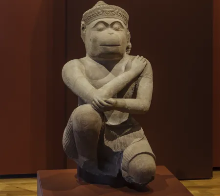 Zoomed in photo of statue crossing arm over itself
