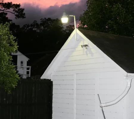 photo of white house in front of sunset