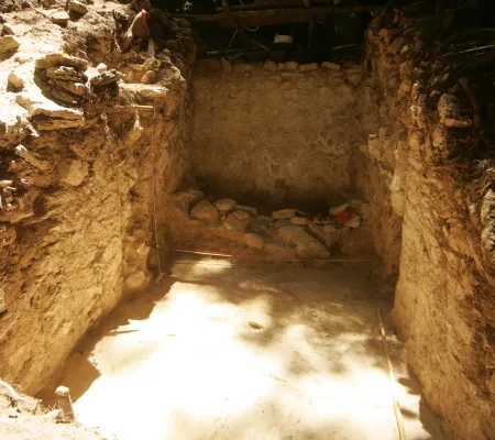 image of a cave with light coming in from the top left 