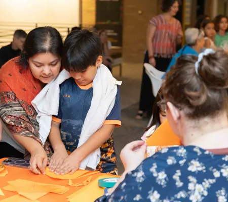 image of a family working on an art project together