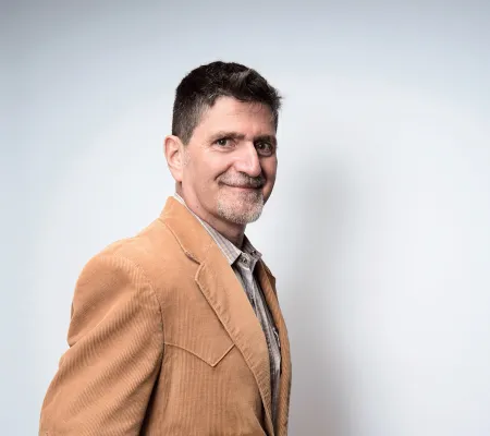 headshot in front of gray background