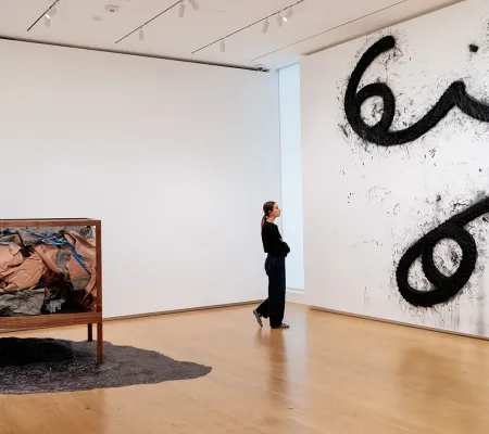 image of a person looking at work in a gallery