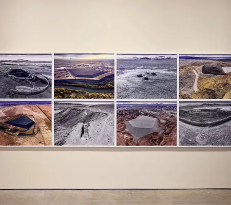 installation image of 8 photographs in a gallery