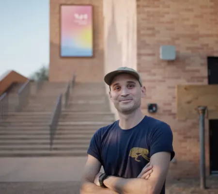 image of a man standing in front of the visual arts center