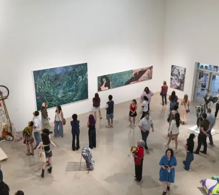 people in gallery during art opening