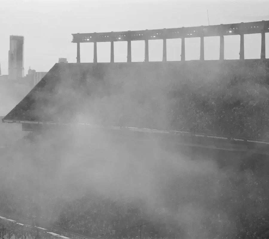 ariel view of Texas Memorial Stadium with smoke in foreground