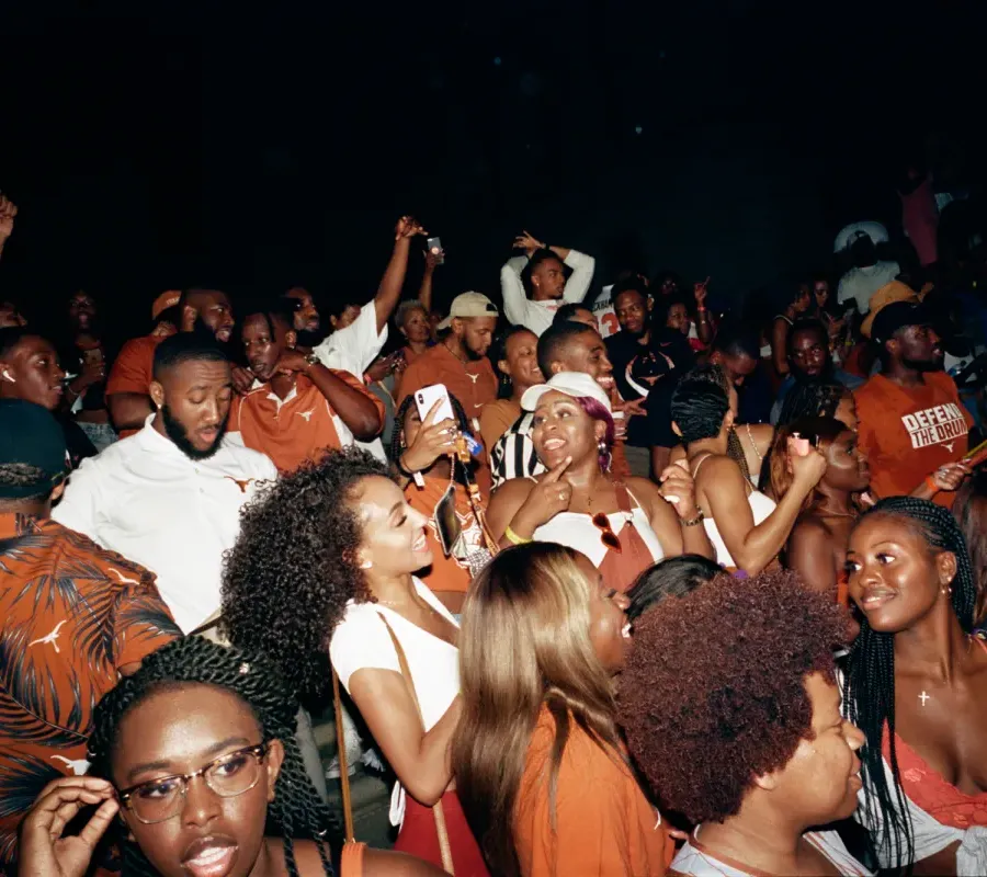 Photo of Black students at the University of Texas at Austin at a party for what seems to be UT's homecoming. 