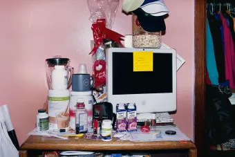 desk cluttered with objects