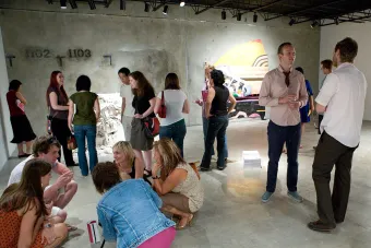 group of people in gallery during opening